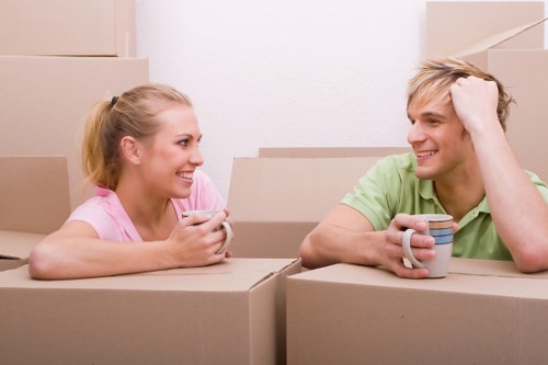 Packed moving boxes and furniture ready for transport in Clapham