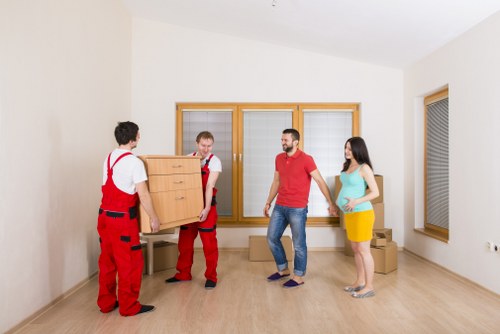 Boxes and household items being loaded into a van