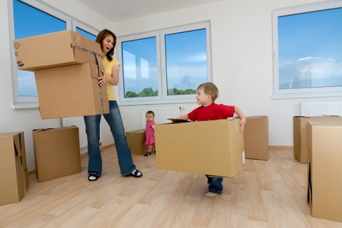 Professional movers handling furniture in a Clapham flat move