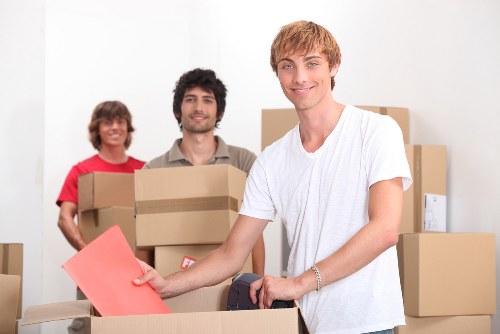 Local moving team packing belongings in a Clapham property with access challenges